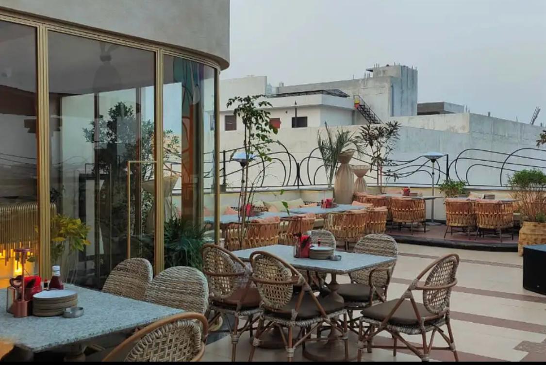 Rooftop hospitality furniture — weatherproof rattan, aluminium and teak collections manufactured by Venus Creatives, Greater Noida, India