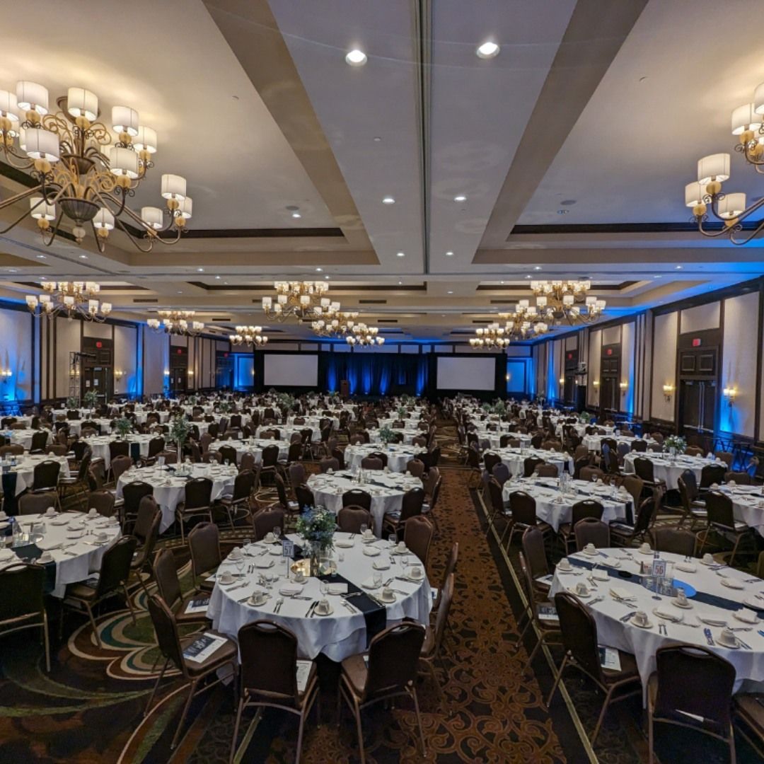 Ballroom stacking chairs set in a large convention banquet hall